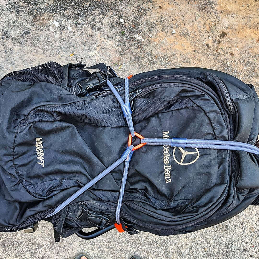 Mototech Hexapod bungee cord review showcasing the secured black backpack with bungee cords.